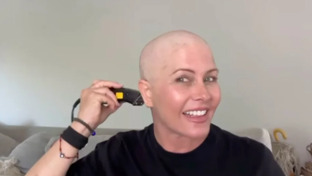 Nicole eggert shaves her head amid treatment for breast cancer