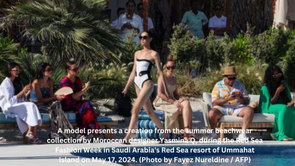 A model presents a creation from the summer beachwear collection by moroccan designer yasmina q during the red sea fashion week in saudi arabias red sea resort of ummahat island on may 17 2024